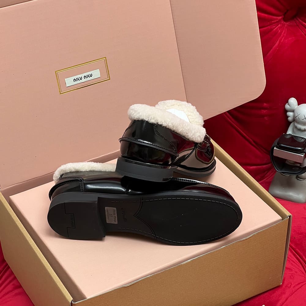 M1um1u Bleached leather and shearling penny loafers